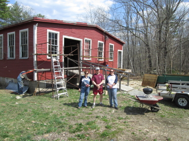 Liberty Mutual volunteers painting the Drew Mill